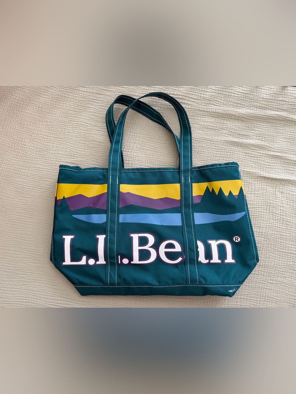 L.L. Bean teal canvas tote with yellow and purple mountain graphic